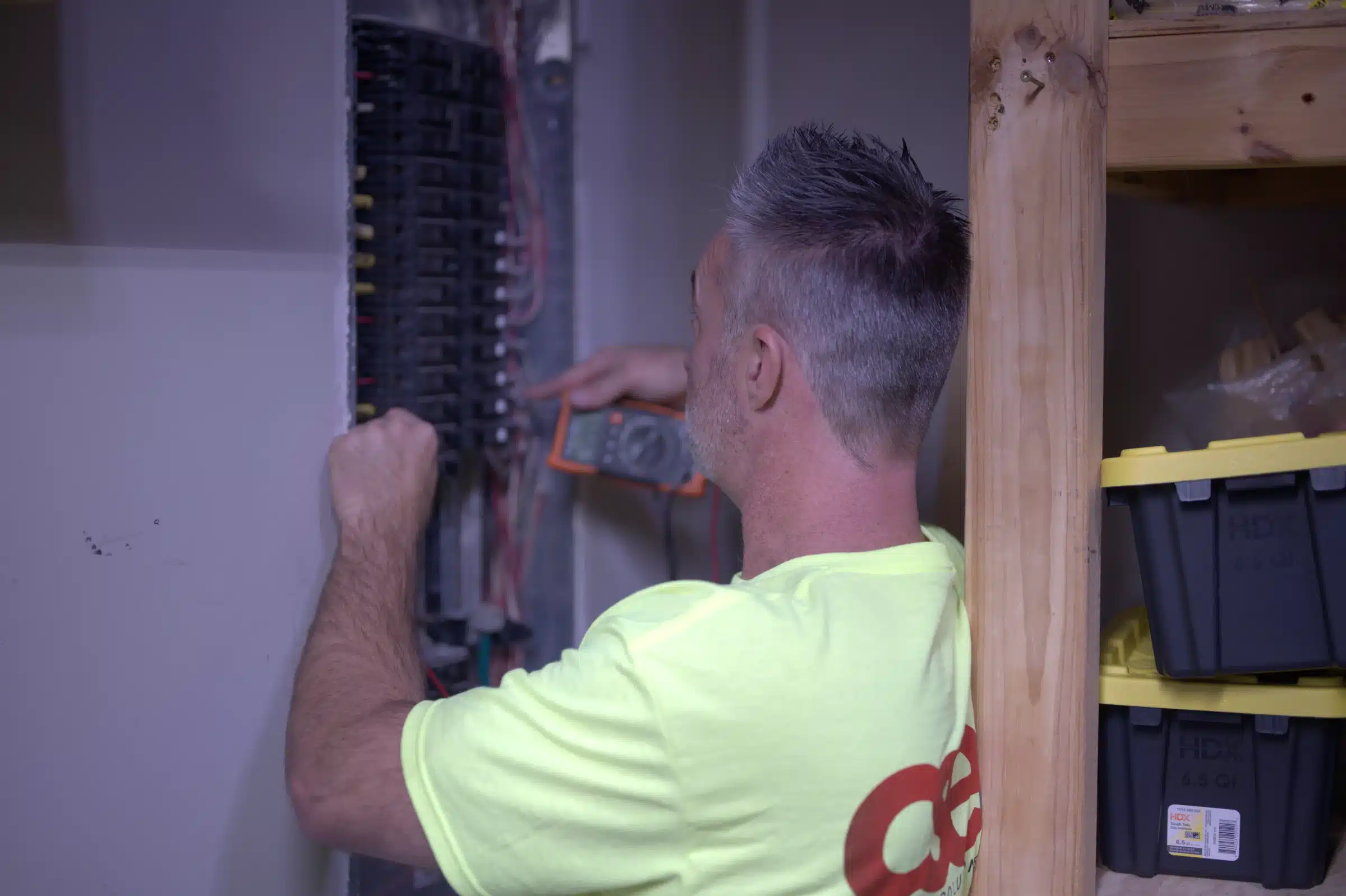 Electrician working on electrical panel upgrade in Kansas City, showcasing safety and efficiency improvements.