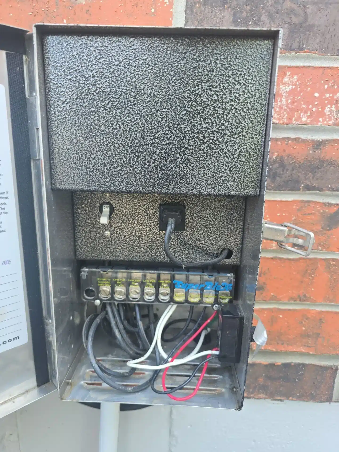 Generator transfer switch installation in Kansas City, MO, showcasing electrical connections and components for reliable power management.